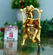 Golden Lord Ganesha Statue Sitting On A Rocking Chair And Reading Ramayan Showpiece